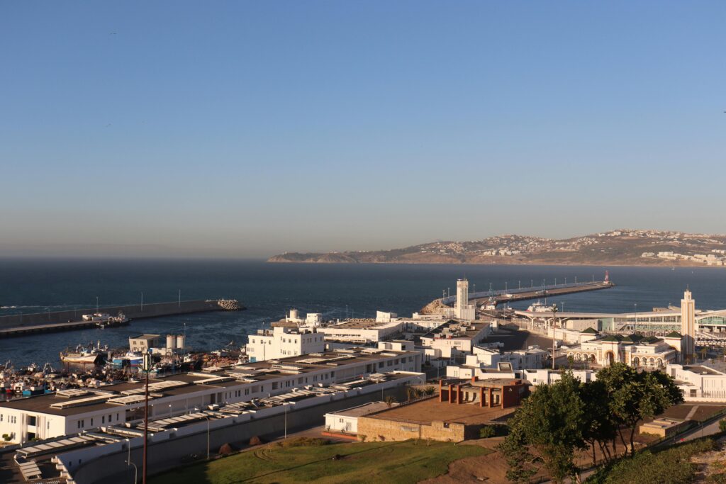 A captivating view of Tanger harbor with the ocean and city in the background.